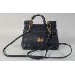 A GOOD DOLCE AND GABBANA BLACK CROCODILE OR SNAKESKIN BAG. 9ins long, 7ins high, in a dust bag.