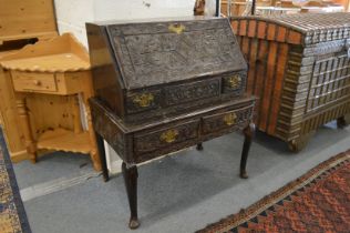 AN 18TH CENTURY BUREAU ON STAND, later carved, with a drop flap, two small drawers and two drawers
