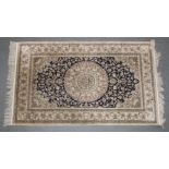 A GOOD PERSIAN PART SILK RUG with stylised floral decoration on a cream, blue ground. 155cm x 93cm.