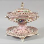 A CONTINENTAL PINK PORCELAIN CIRCULAR TUREEN, COVER AND STAND.