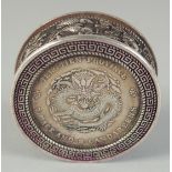 A CHINESE WHITE METAL COIN BOX. 1.75ins diameter.