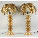 A GOOD PAIR OF GILDED METAL PALM TREE TABLE LAMPS. 28ins high.