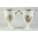 A PAIR OF WHITE GROUND PORCELAIN TWO HANDLED VASES painted with birds and flowers. 1ft 6ins high.