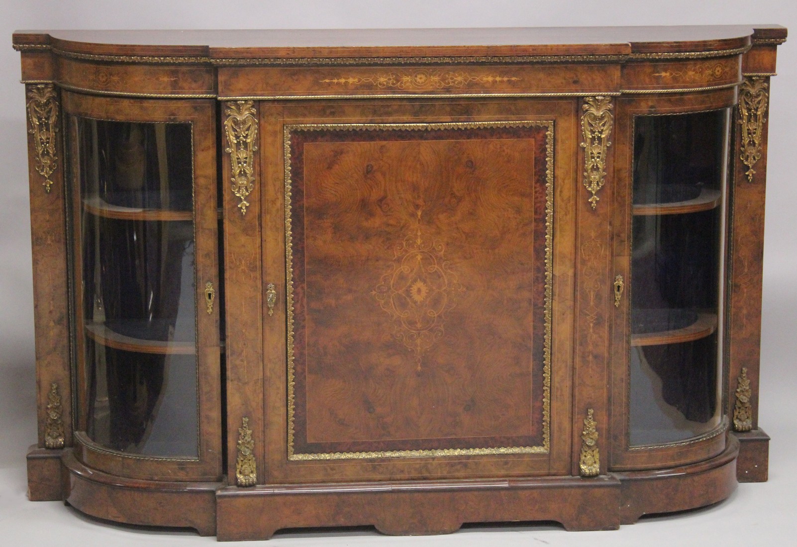 A GOOD VICTORIAN WALNUT AND MARQUETRY CREDENZA by EDWARD & ROBERTS with figured walnut top, ormolu
