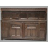 A GOOD 18TH CENTURY OAK COURT CUPBOARD, GOOD COLOUR with plain top, the front with carved frieze
