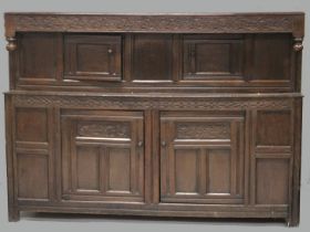 A GOOD 18TH CENTURY OAK COURT CUPBOARD, GOOD COLOUR with plain top, the front with carved frieze