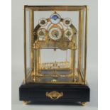 A GOOD ROLLING BALL MOON CONCAVE CLOCK with six dials, brass mounts, glass cover, on a stand with