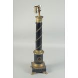 AN EMPIRE BLACK METAL COLUMN LAMP on a square base with claw feet. 24ins high.