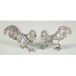 A PAIR OF CAST SILVER COCKEREL CASTERS. 3.25ins.