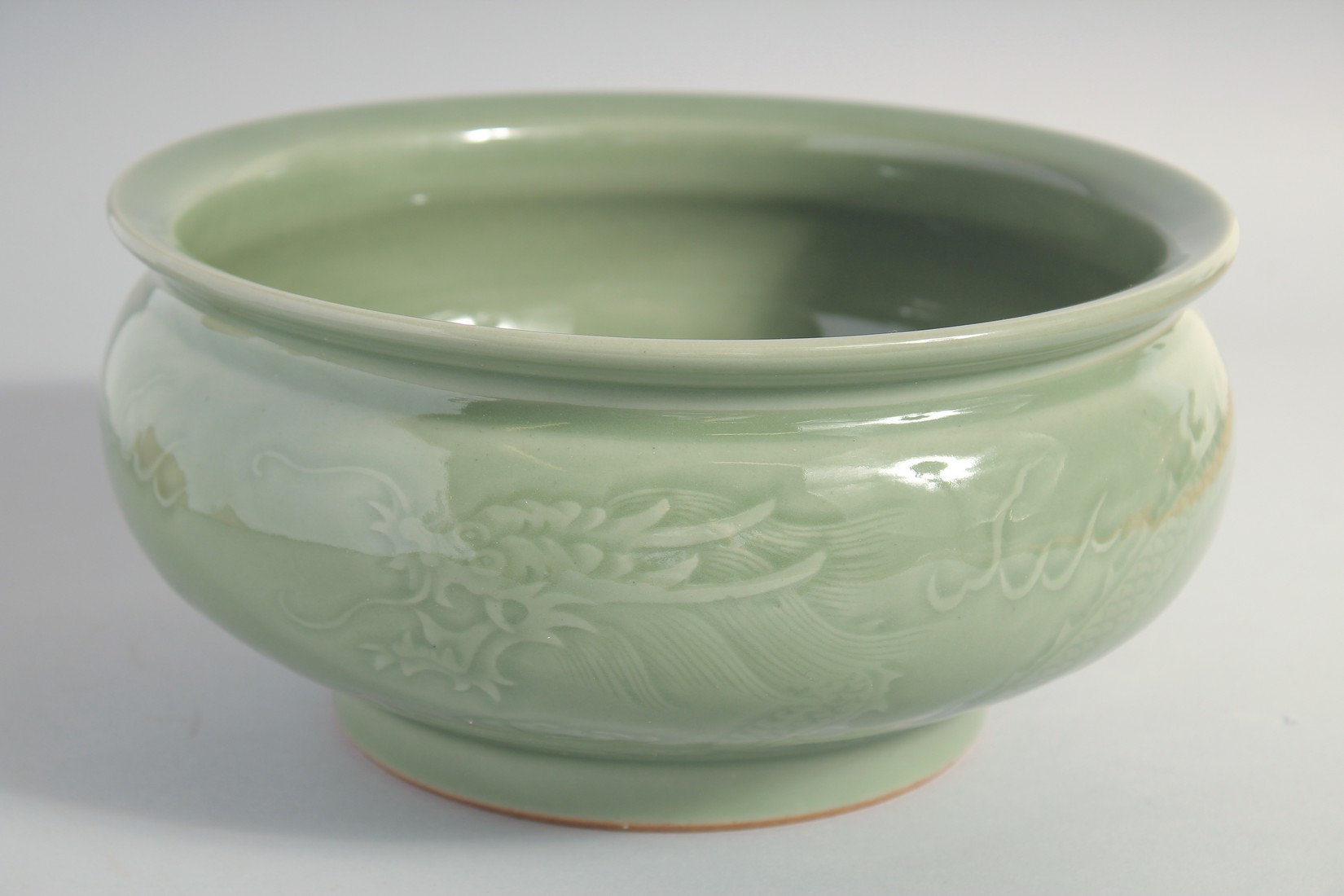 A LARGE CHINESE CELADON GLAZE BOWL, carved with dragon and the flaming pearl of wisdom, 25.5cm - Image 4 of 5