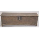 A VERY EARLY POSSIBLY 16TH CENTURY OAK SWORD CHEST with plain plank top and sides. The front with