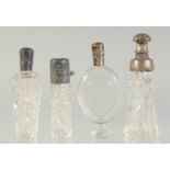 FOUR SILVER TOP SCENT BOTTLES.