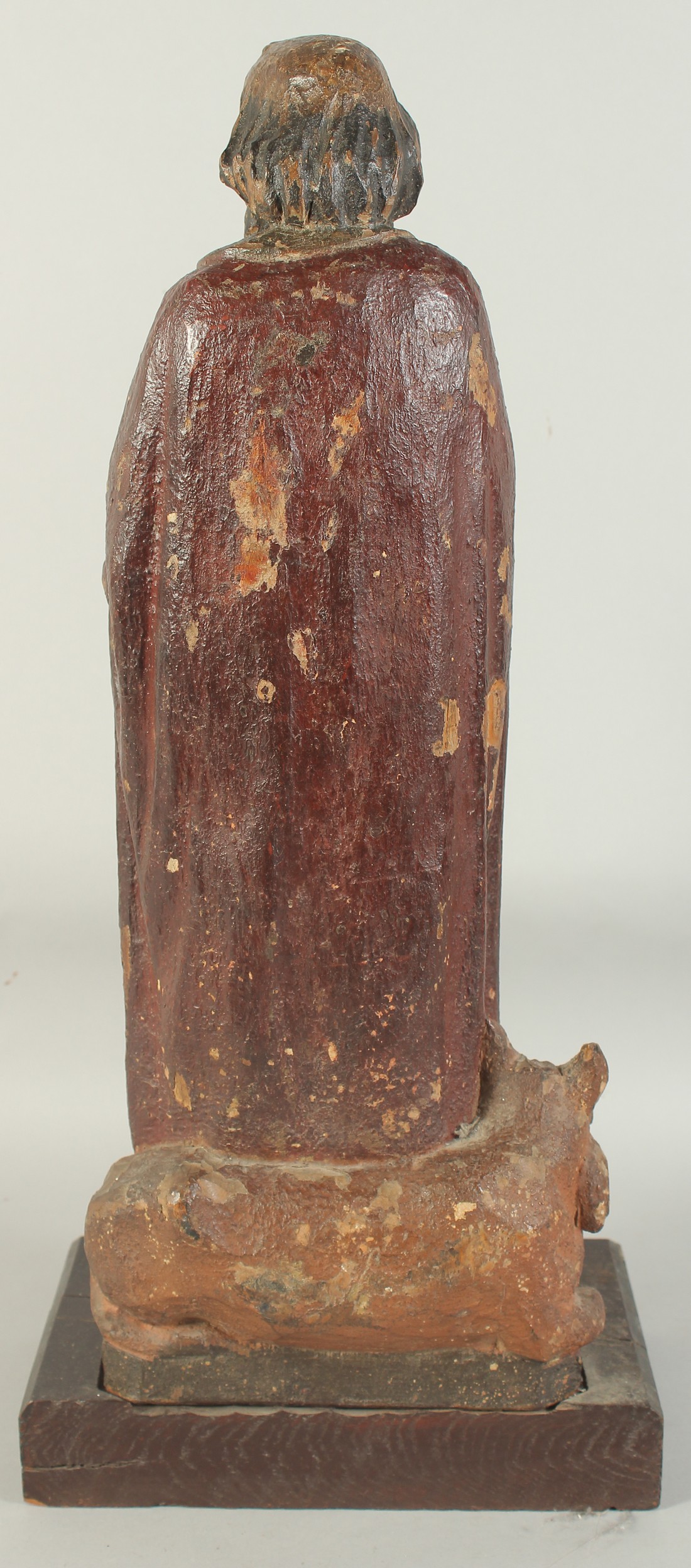 A GOOD 17TH CENTURY CARVED WOOD AND POLYCHROME FIGURE, ST. LUC, on a wooden base. 1ft 11ins high. - Image 6 of 7