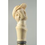 A CARVED BONE HANDLED WALKING STICK "MAN'S HEAD WITH CAP".