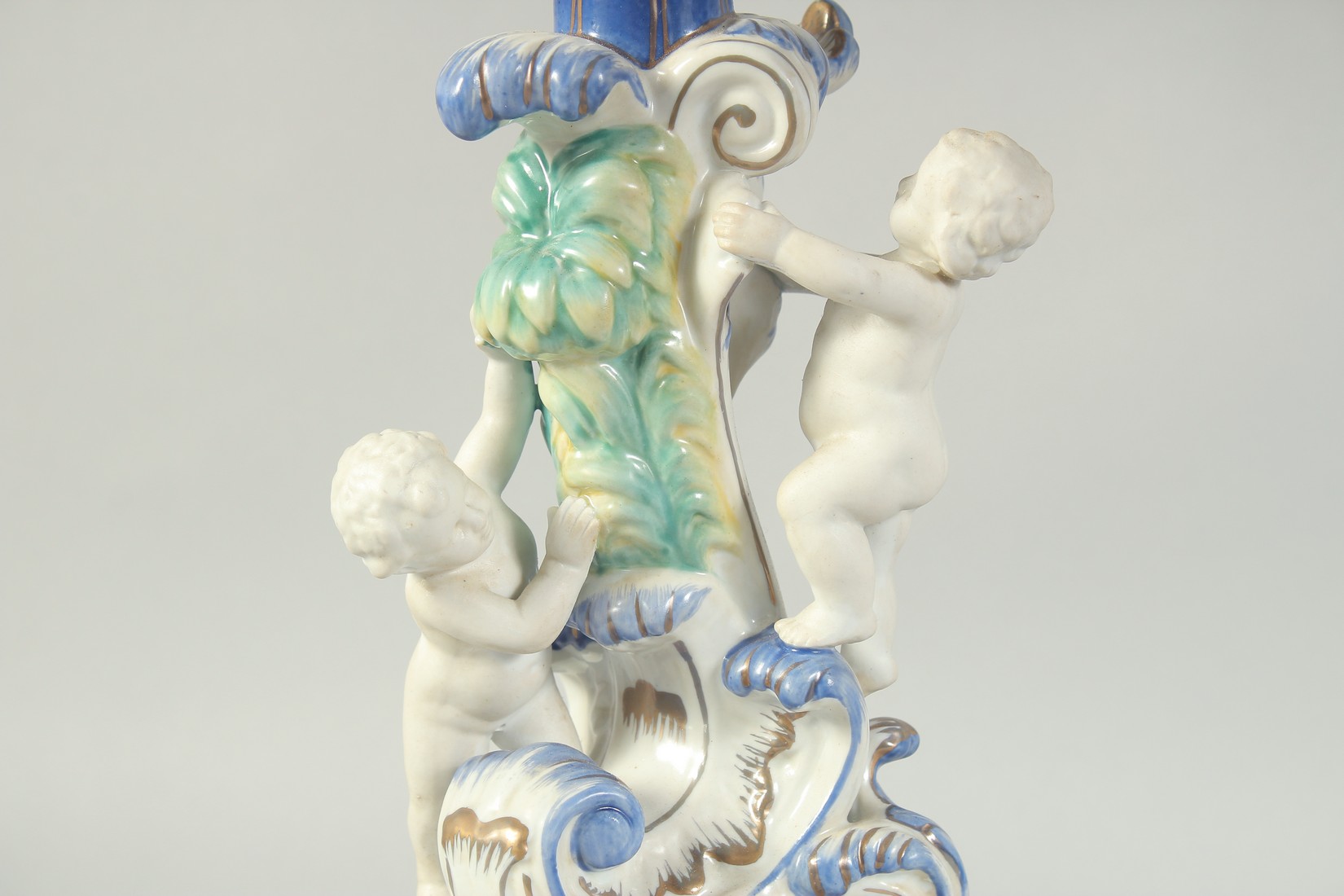 A GOOD PAIR OF SEVRES STYLE EIGHT BRANCH CANDELABRA with cupid support on blue bases. 1ft 11ins - Image 4 of 5