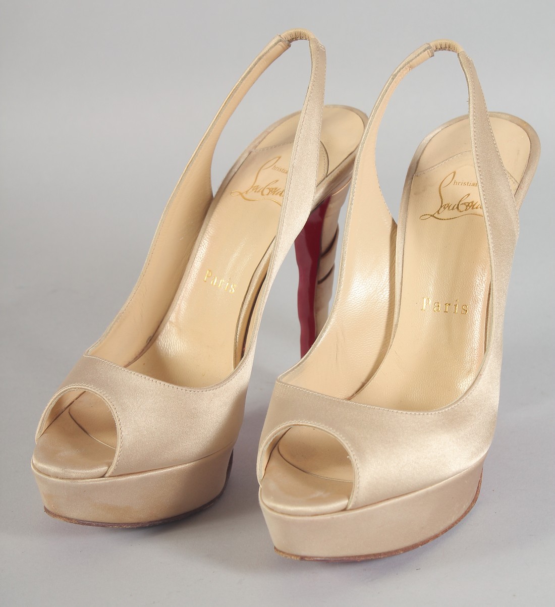 A PAIR OF CHRISTIAN LOUBOUTIN BEIGE SHOES, and five heal tips. Size 37.