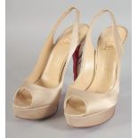 A PAIR OF CHRISTIAN LOUBOUTIN BEIGE SHOES, and five heal tips. Size 37.