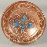 AN HISPANO MORESQUE LARGE CIRCULAR CHARGER with blue flowers. Possibly 16th Century. 34cm diameter.