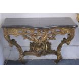 A SUPERB NEAR PAIR OF 18TH CENTURY ITALIAN CARVED AND PIERCED GILTWOOD CONSOLE TABLES with marble