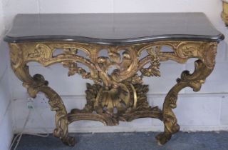 A SUPERB NEAR PAIR OF 18TH CENTURY ITALIAN CARVED AND PIERCED GILTWOOD CONSOLE TABLES with marble