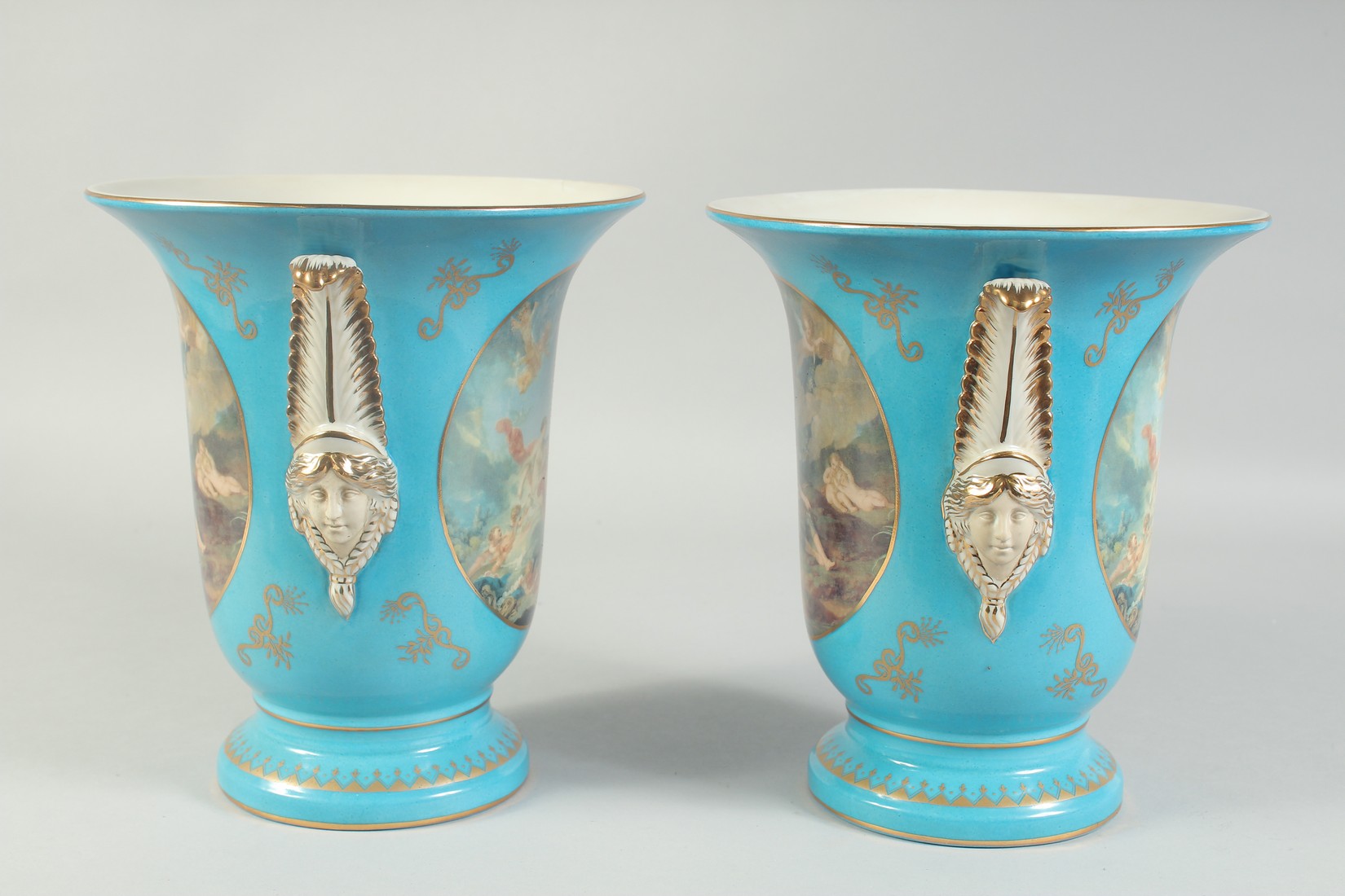 A PAIR OF SEVRES STYLE LIGHT BLUE VASES with panels of classical scenes. 10ins high. - Image 2 of 3