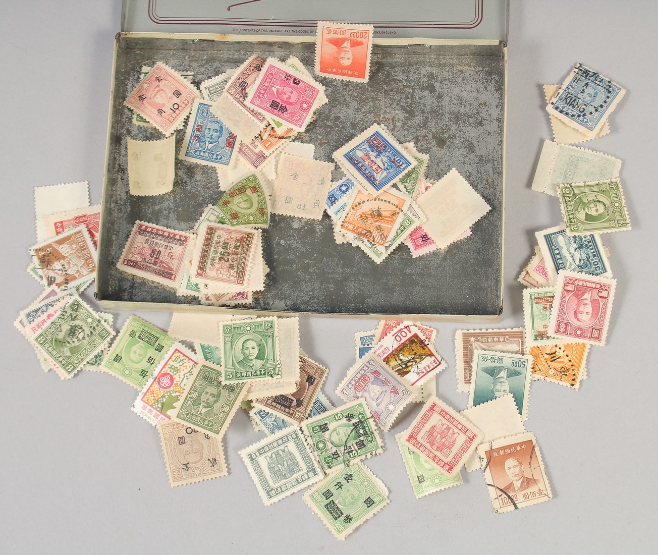 A BOX OF OLD CHINESE STAMPS.