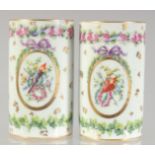 A PAIR OF PORCELAIN SPILL VASES painted with flowers and bow and arrows. 4ins high.