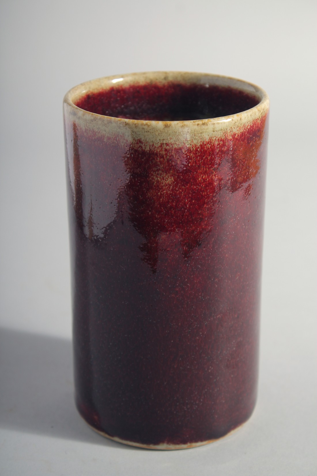 A CHINESE IRON RED GLAZE CYLINDRICAL BRUSH POT, 15cm high. - Image 5 of 5