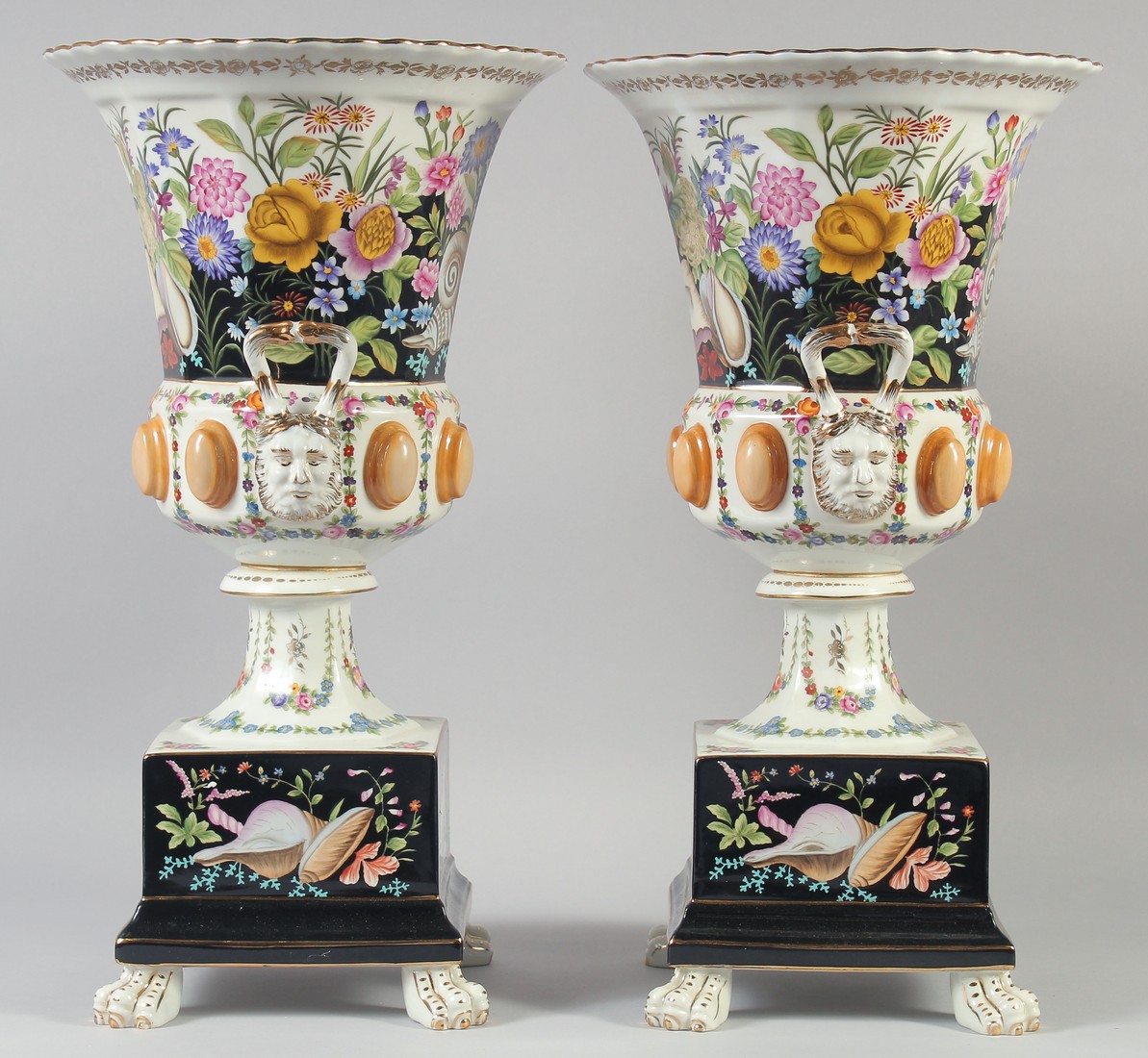 A GOOD LARGE PAIR OF CONTINENTAL TWO HANDLED URN SHAPED VASES ON STANDS on claw feet. 18ins high. - Image 2 of 4