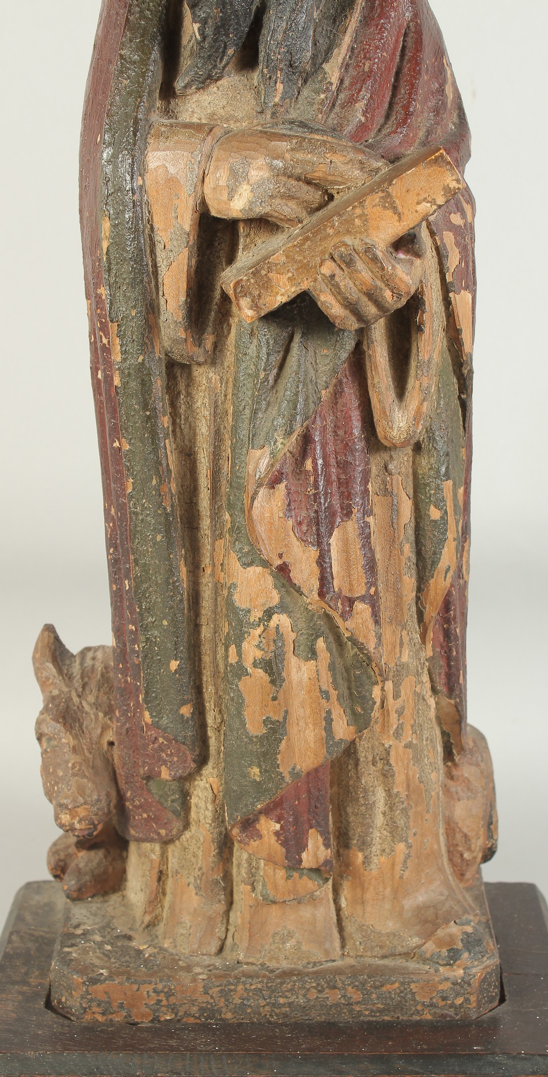 A GOOD 17TH CENTURY CARVED WOOD AND POLYCHROME FIGURE, ST. LUC, on a wooden base. 1ft 11ins high. - Image 3 of 7