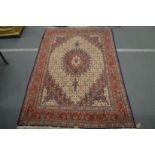 A PERSIAN CARPET, cream ground with floral decoration. 9ft 6ins x 6ft 8ins.
