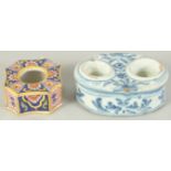 TWO FAIENCE TIN GLAZE INK POTS, one blue and white with two ink pots, the other coloured with one