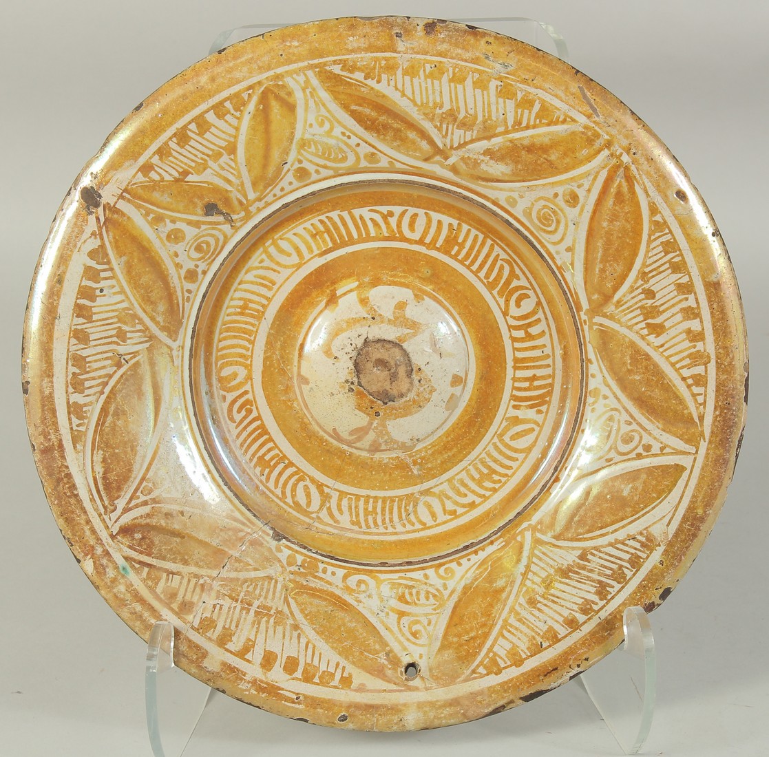 A HISPANO MORESQUE LACQUERED CIRCULAR CHARGER. Possibly 16th Century. 32cm diameter.