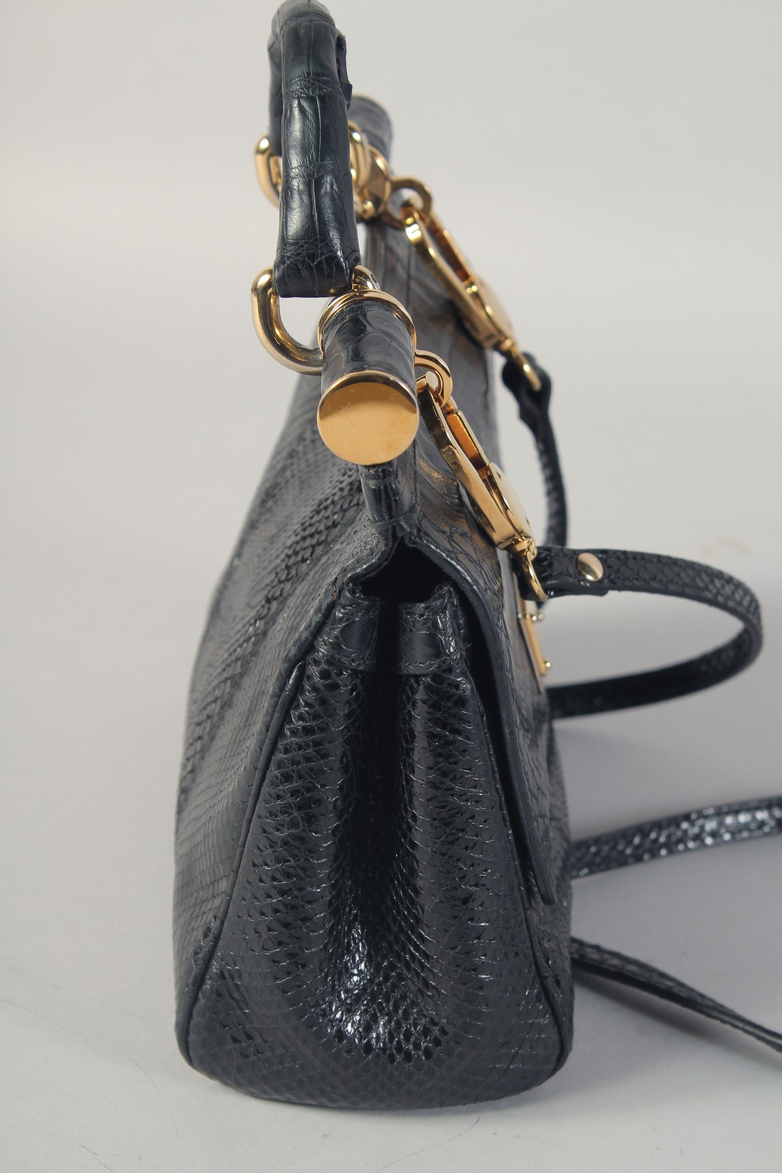 A GOOD DOLCE AND GABBANA BLACK CROCODILE OR SNAKESKIN BAG. 9ins long, 7ins high, in a dust bag. - Image 5 of 7