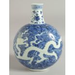 A CHINESE BLUE AND WHITE PORCELAIN MOON FLASK VASE, with incised white dragon on stylised waves,