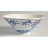 A CHINESE BLUE, WHITE AND UNDERGLAZE RED PORCELAIN BOWL, painted with pomegranate, 16cm diameter.
