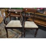 A Regency mahogany dining chair with arms and a pair of similar single chairs.