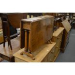 A Victorian walnut Sutherland table.