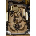 A decorative wrought iron twin branch wall light and a pair of matching single branch wall lights