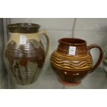 Peter Snagge, Alresford Pottery, a slip glazed jug together with another studio pottery jug.