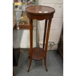 A mahogany two tier jardiniere stand.