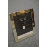 A large silver plated photograph frame.