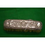 Silver backed dressing table brush.