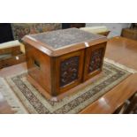 A very good Victorian carved walnut table top canteen fitted with four graduated drawers.