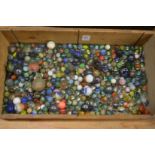A wooden box of marbles.