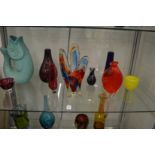 Colourful art glass vases and bowls.