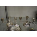 A pair of silver twin branch three light candelabra.