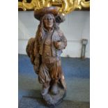 A good large Continental carved wood figure of a gardener.