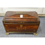A very good Regency brass inlaid rosewood sarcophagus form tea caddy with fitted interior.