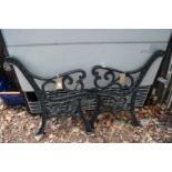 A pair of cast iron bench ends.